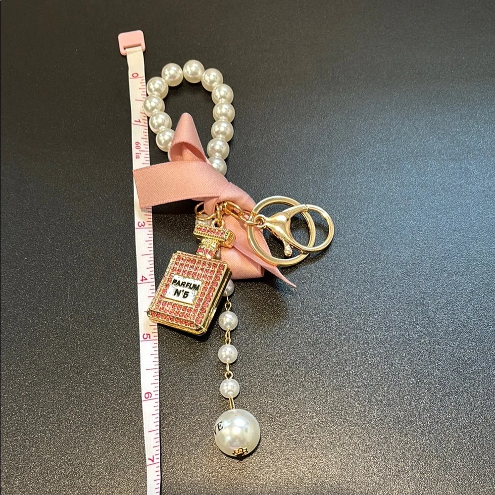 Charm Keychain with Perfume Charm Pearls with pink bow and gold hardware
NWOT - Picture 2 of 2
